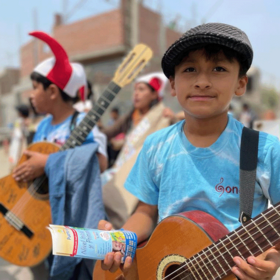 Waldorf pedagogy Peru boy with guitare in Peru